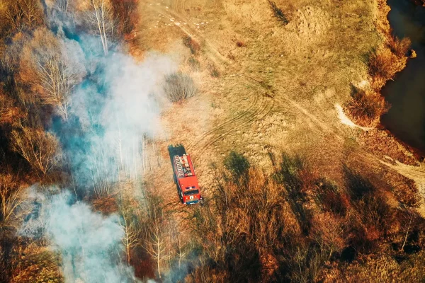 Aerial view spring dry grass burns during drought