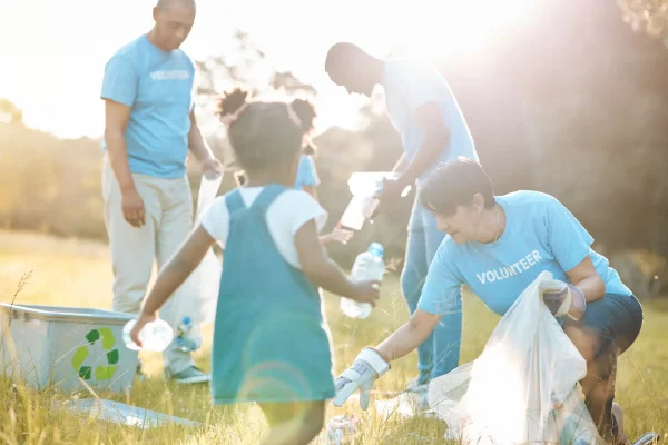 Volunteers cleaning up litter in rural environment